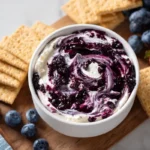 Blueberry‑swirled cheesecake dip with graham crackers